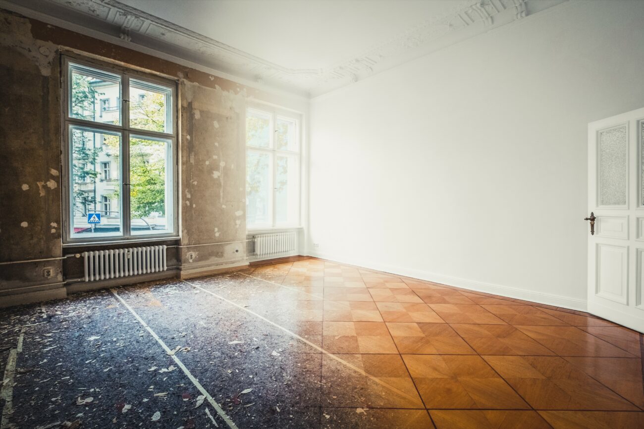 Half of the picture unrenovated room, other half renovated